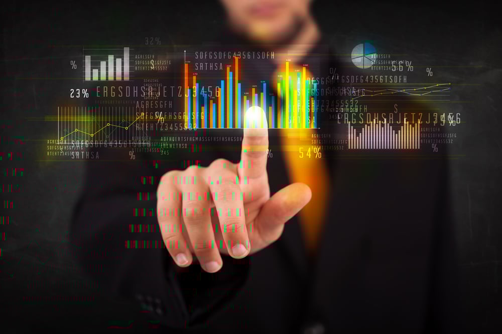 Business person touching colorful charts and diagrams