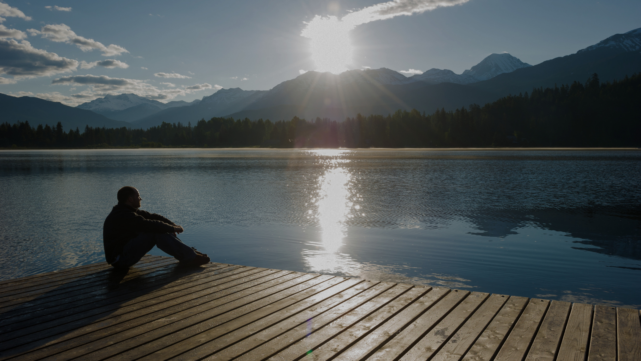 Person reflecting in a dock